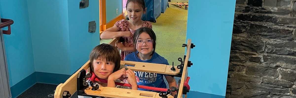 Children playing in rigamjig exhibit